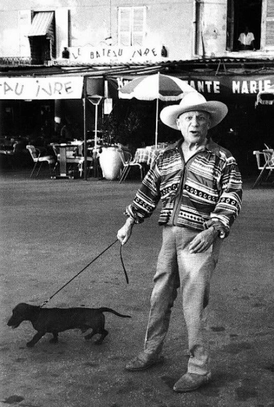 Pablo Picasso with his dog Lump