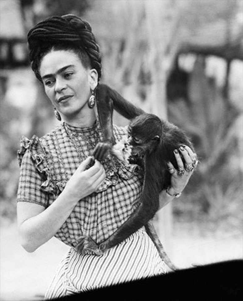 Frida Kahlo holding her pet monkey, Mexico City, 1944