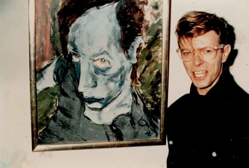 David Bowie with his 1976 painting of Iggy Pop, Portrait of J.O.